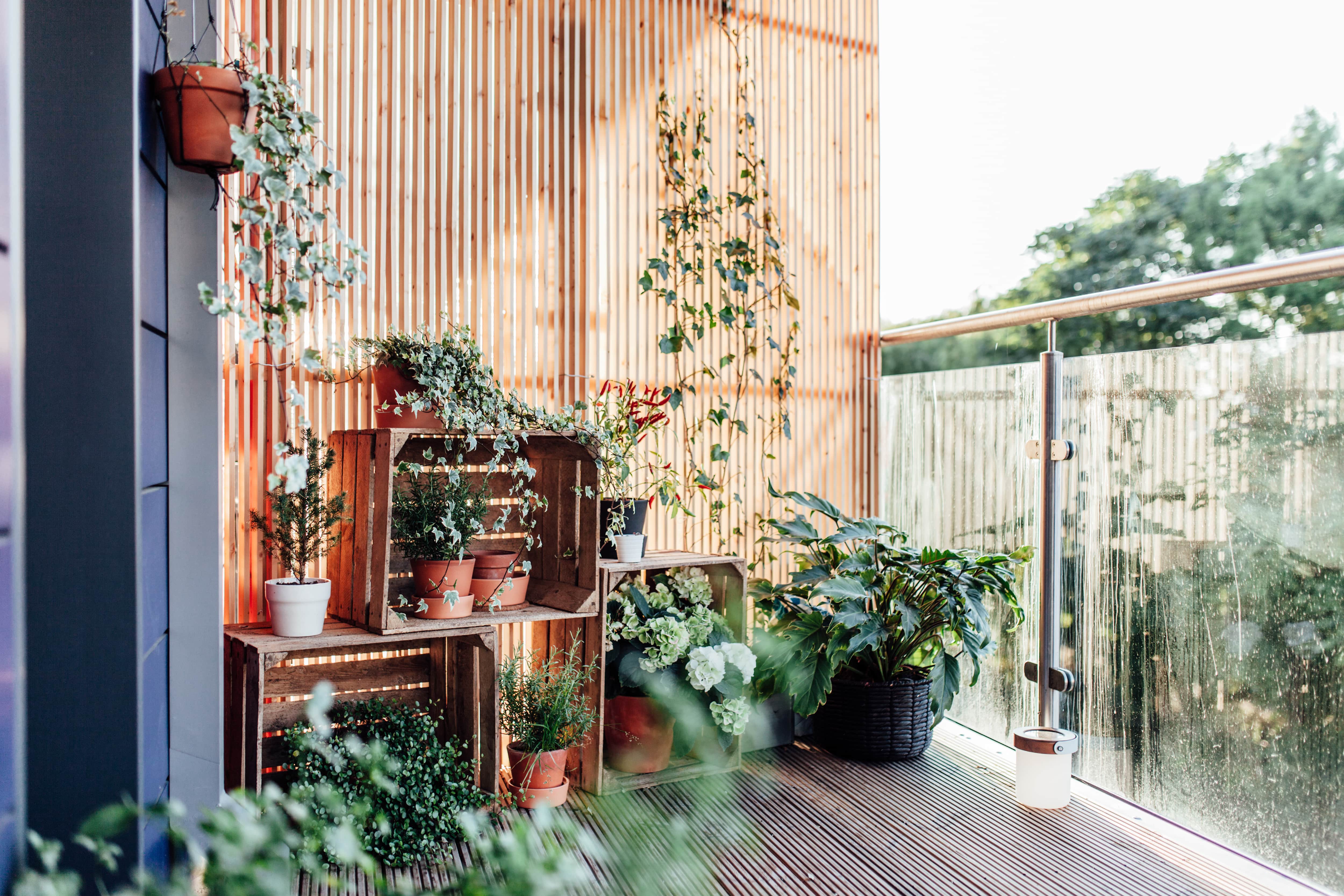 Vertical louver fence on balcony with garden
