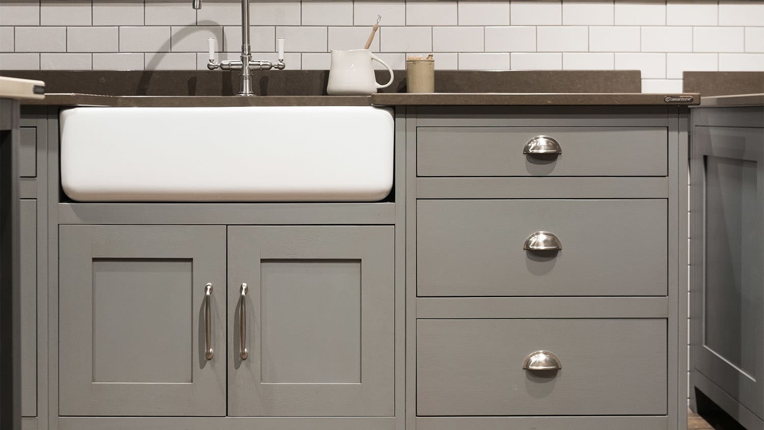 grey kitchen cabinets with cup pull handles