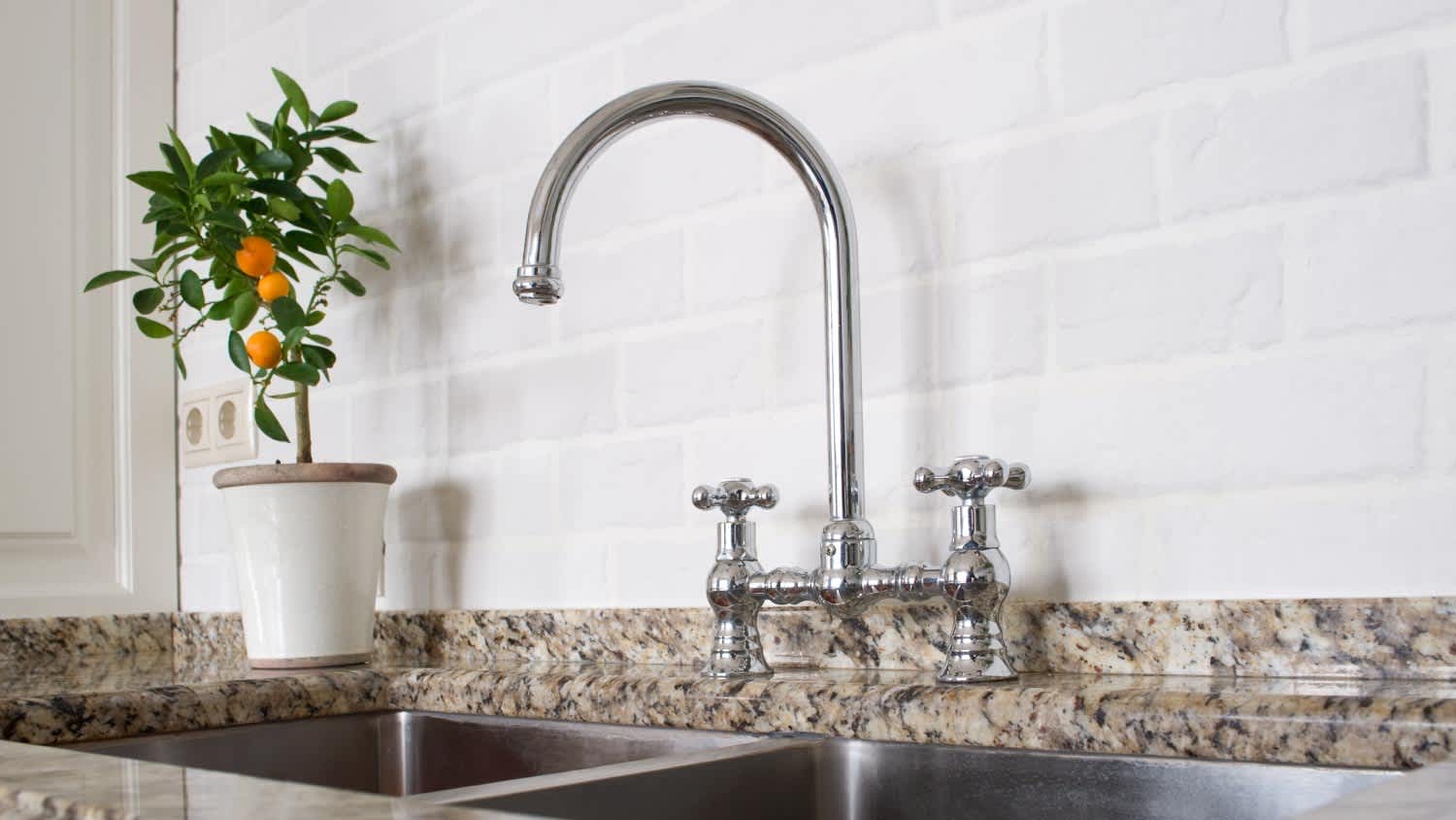 A sink and mixer faucet in kitchen