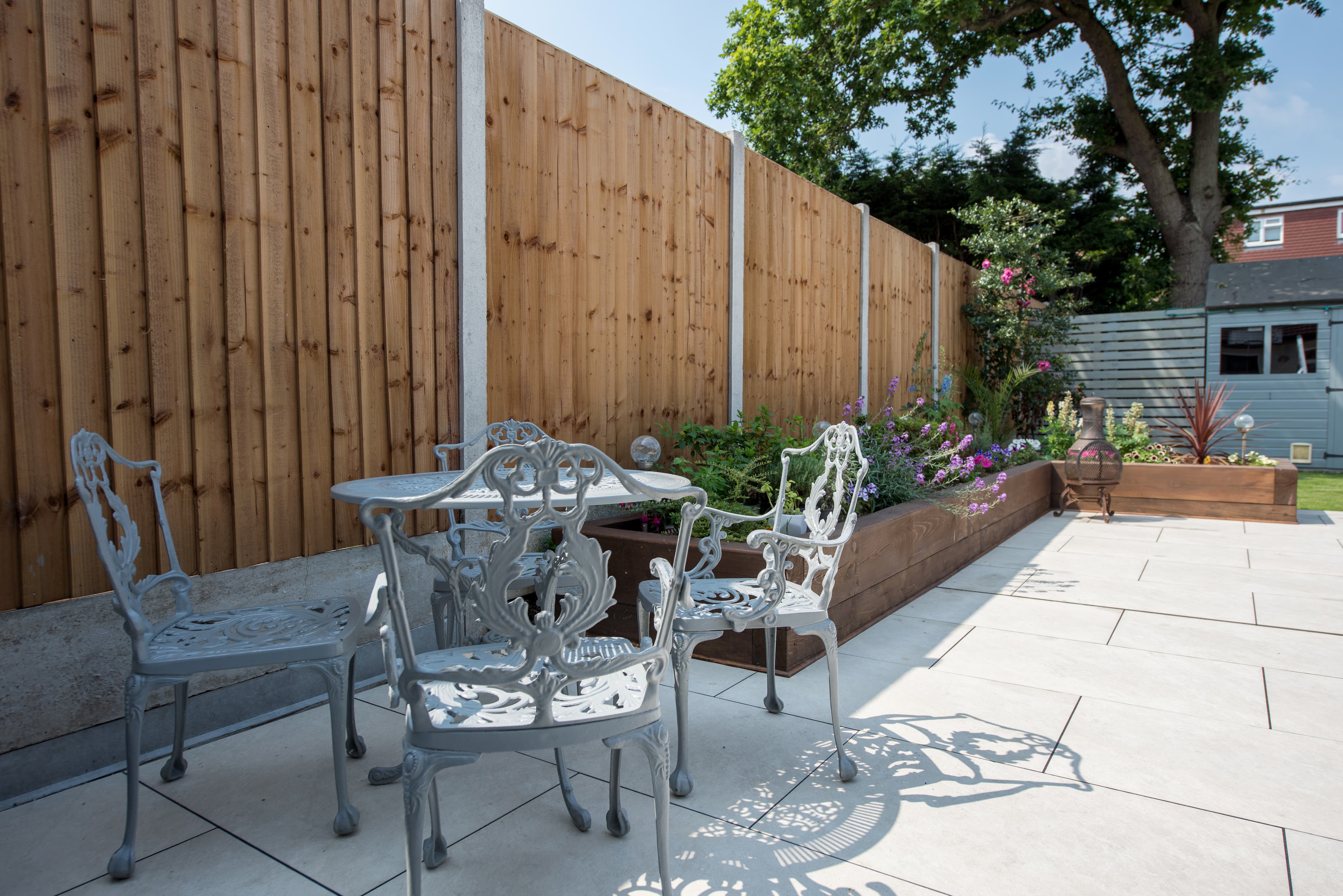 Wood fence with metal post connectors