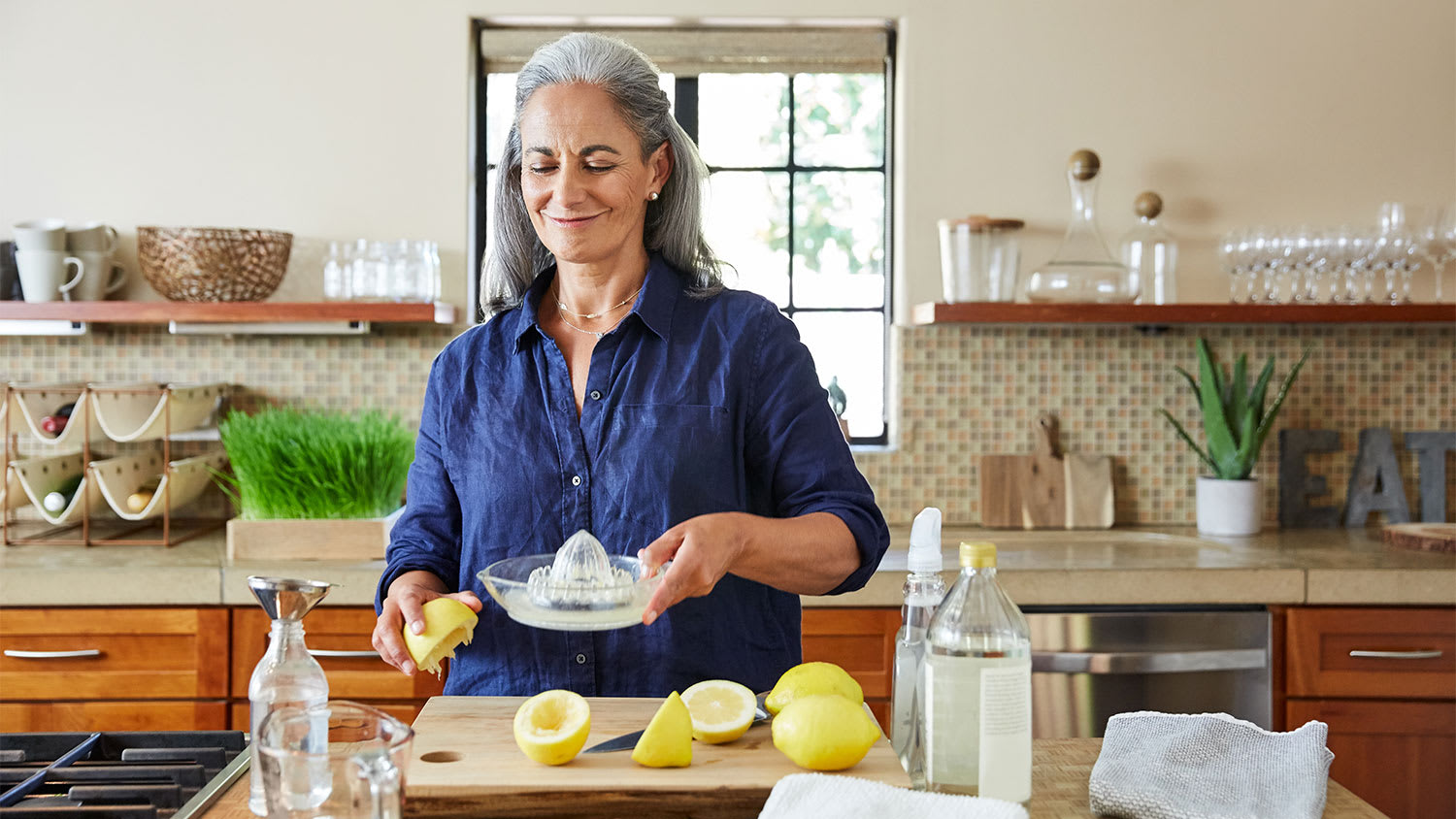 woman in the kitchen making natural cleaning products