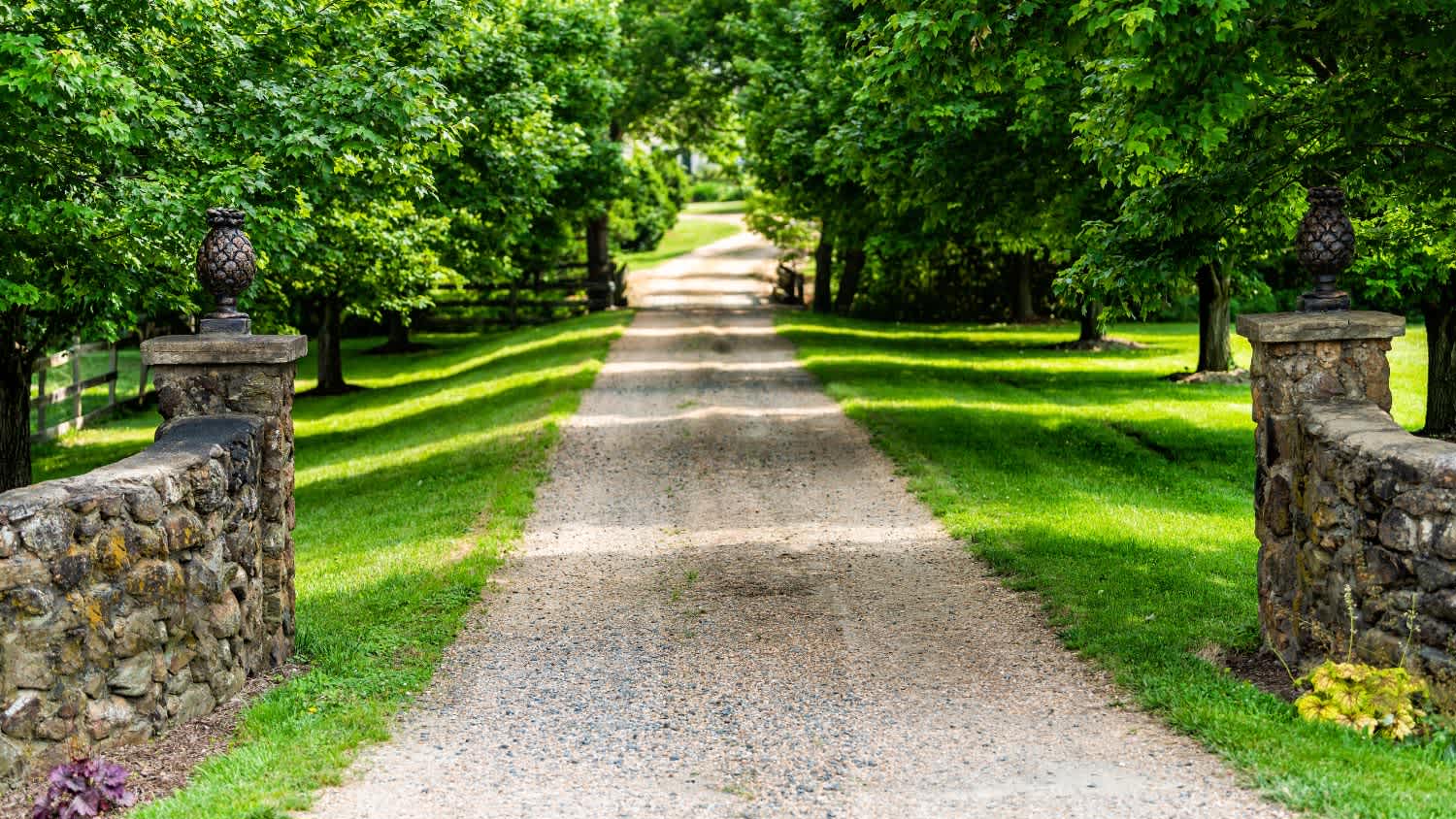 A entrance with road driveway in rural countryside
