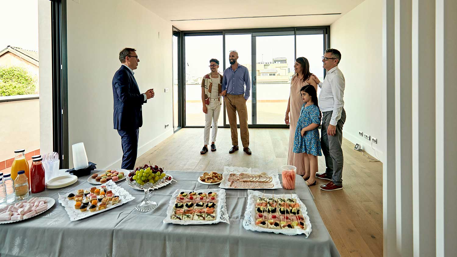 Seller agent talking with clients at open house