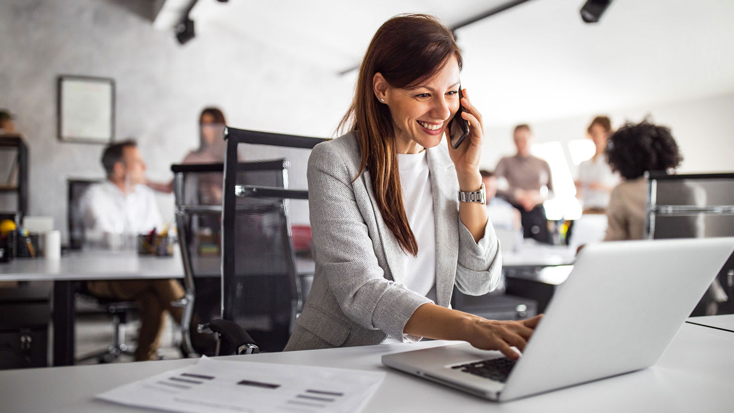 Woman at the office working on her laptop