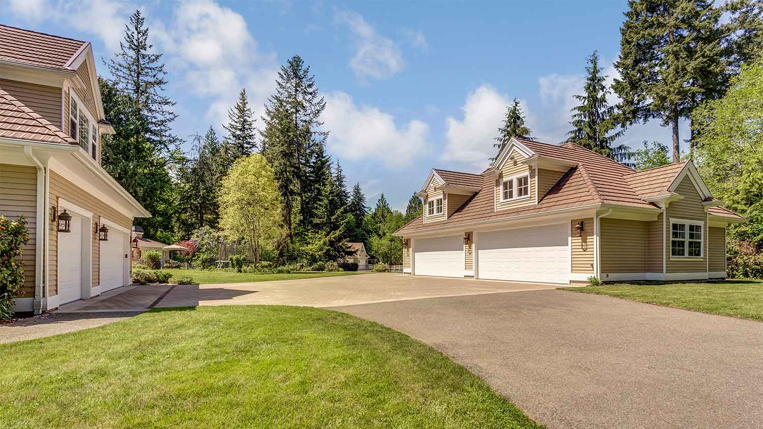 A view of a house with a detached garage