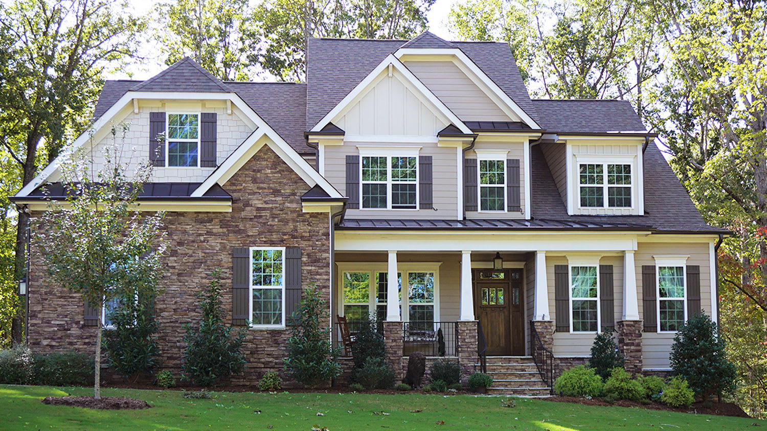suburban home surrounded by trees