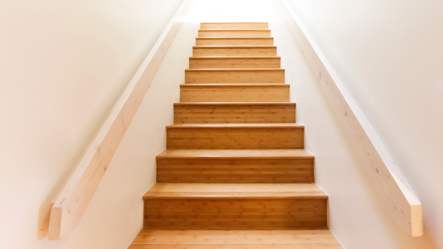 Home staircase with wooden steps and railing