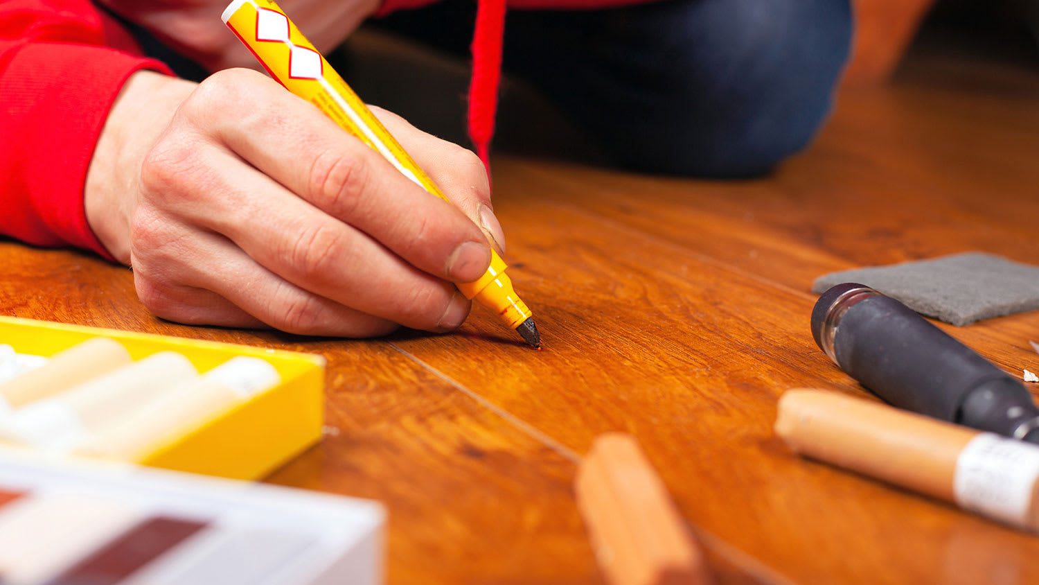 Fixing hardwood floor scratch with a blending pencil