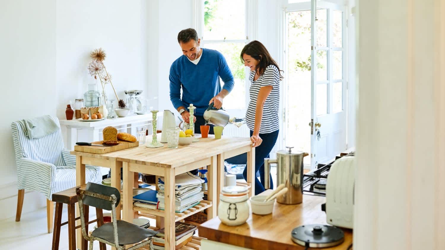 Husband serving coffee to pregnant wife