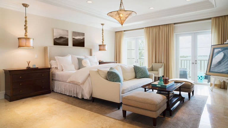 Primary/master bedroom with doors to balcony