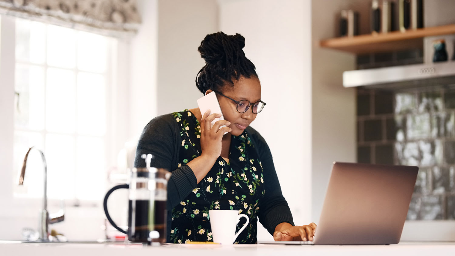 Woman at home making a phone call requesting quotes