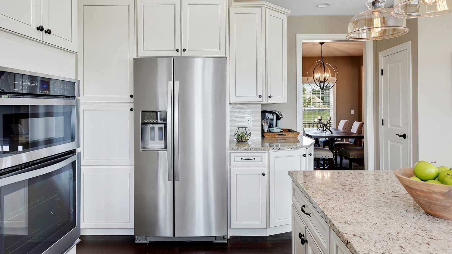 New stainless-steel fridge installed in a large kitchen