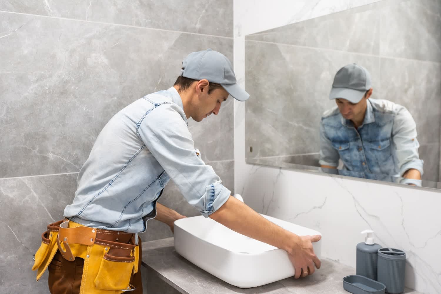 Man installing bathroom sink