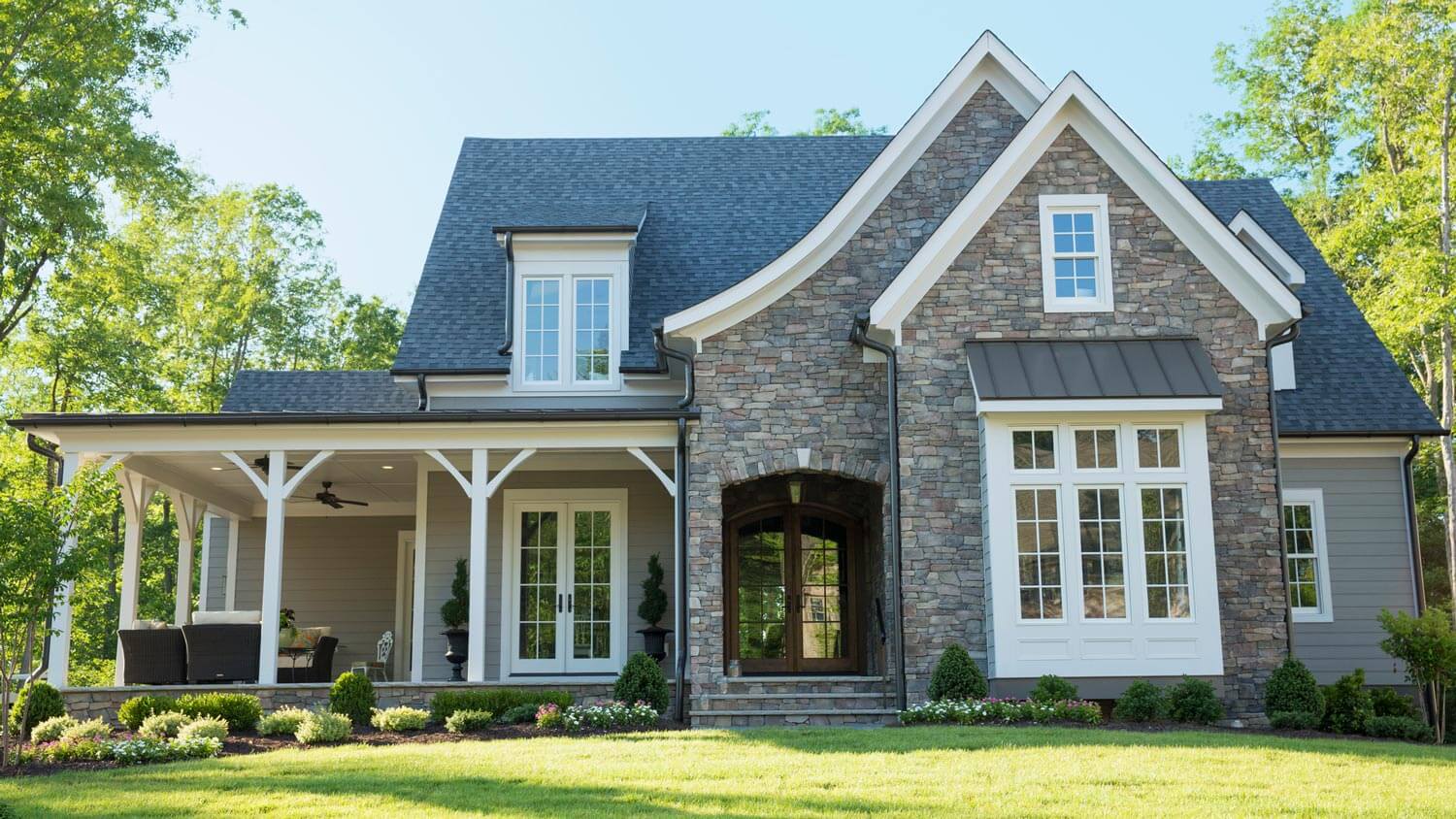 The exterior of a suburban house with its front lawn