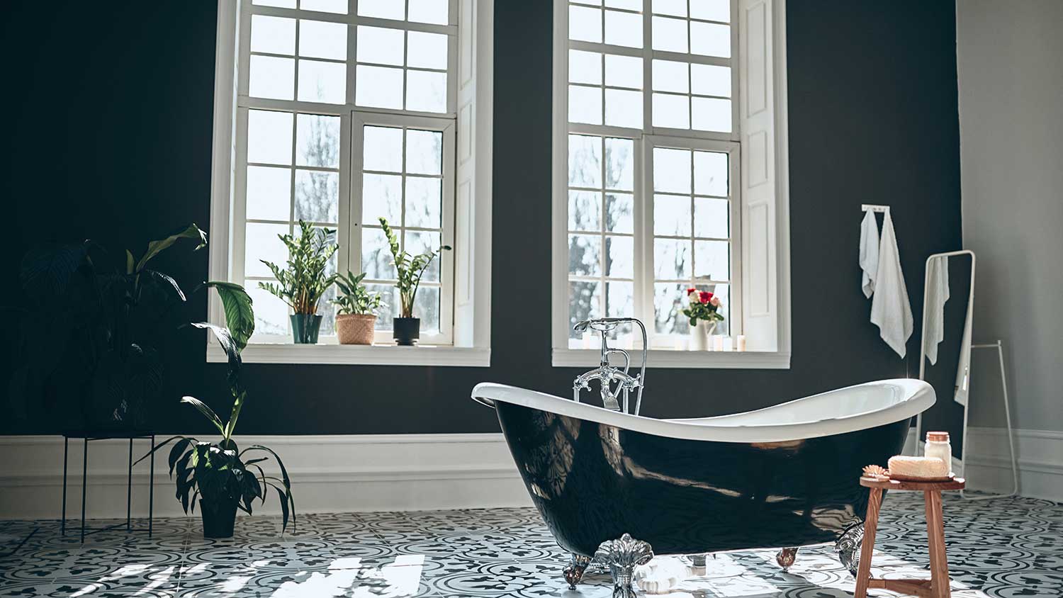 Black vintage bathtub in a bright bathroom