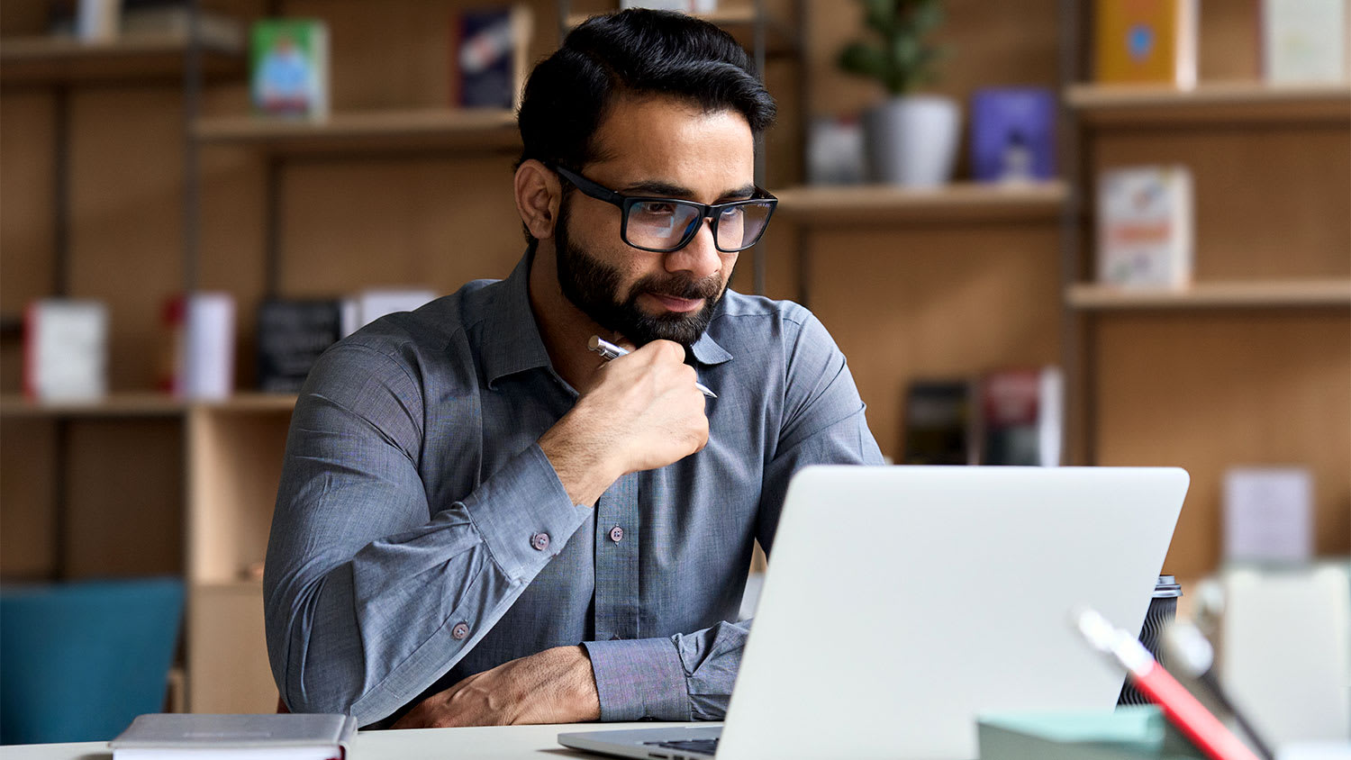 A man sits at a computer
