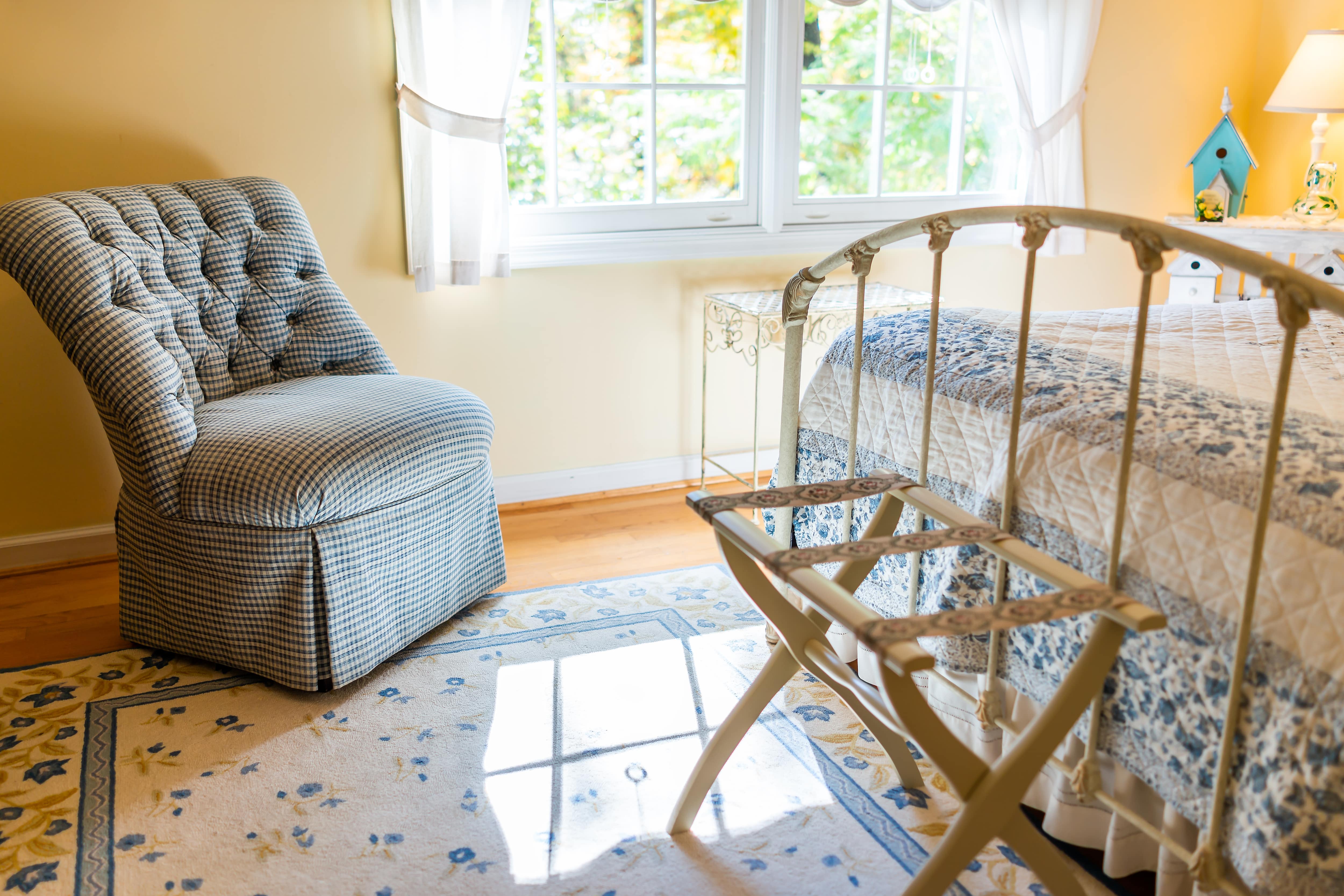Gingham accent chair in farmhouse bedroom