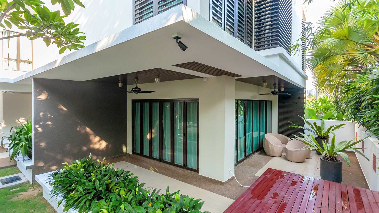Modern house with security camera installed in the yard