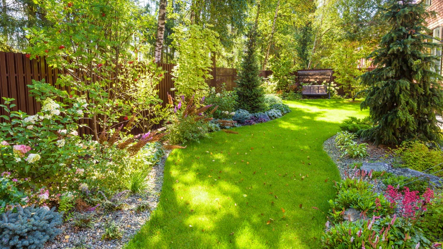 A landscape design with plants and flowers at residential house