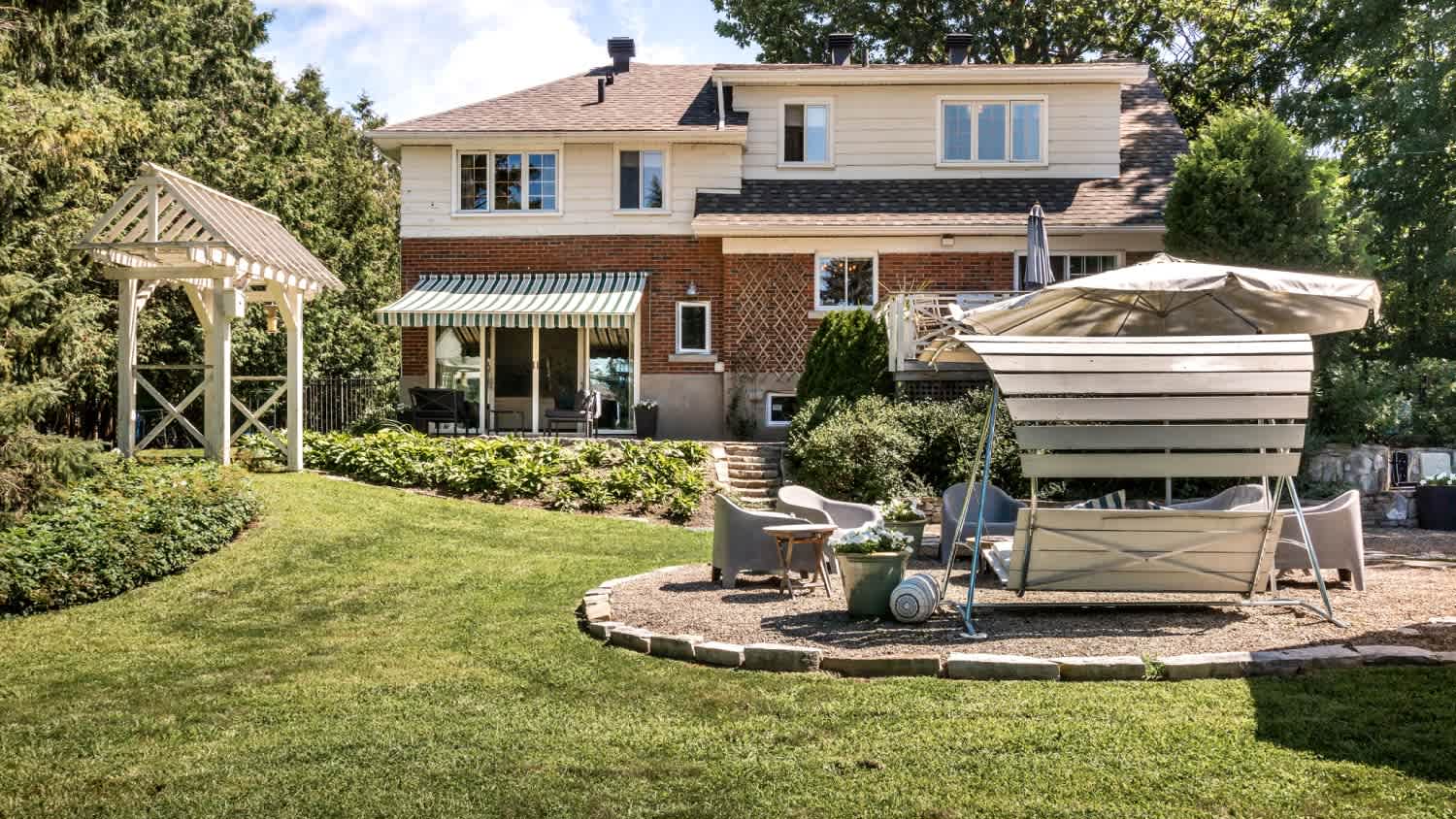 A house with a huge backyard and swimming pool
