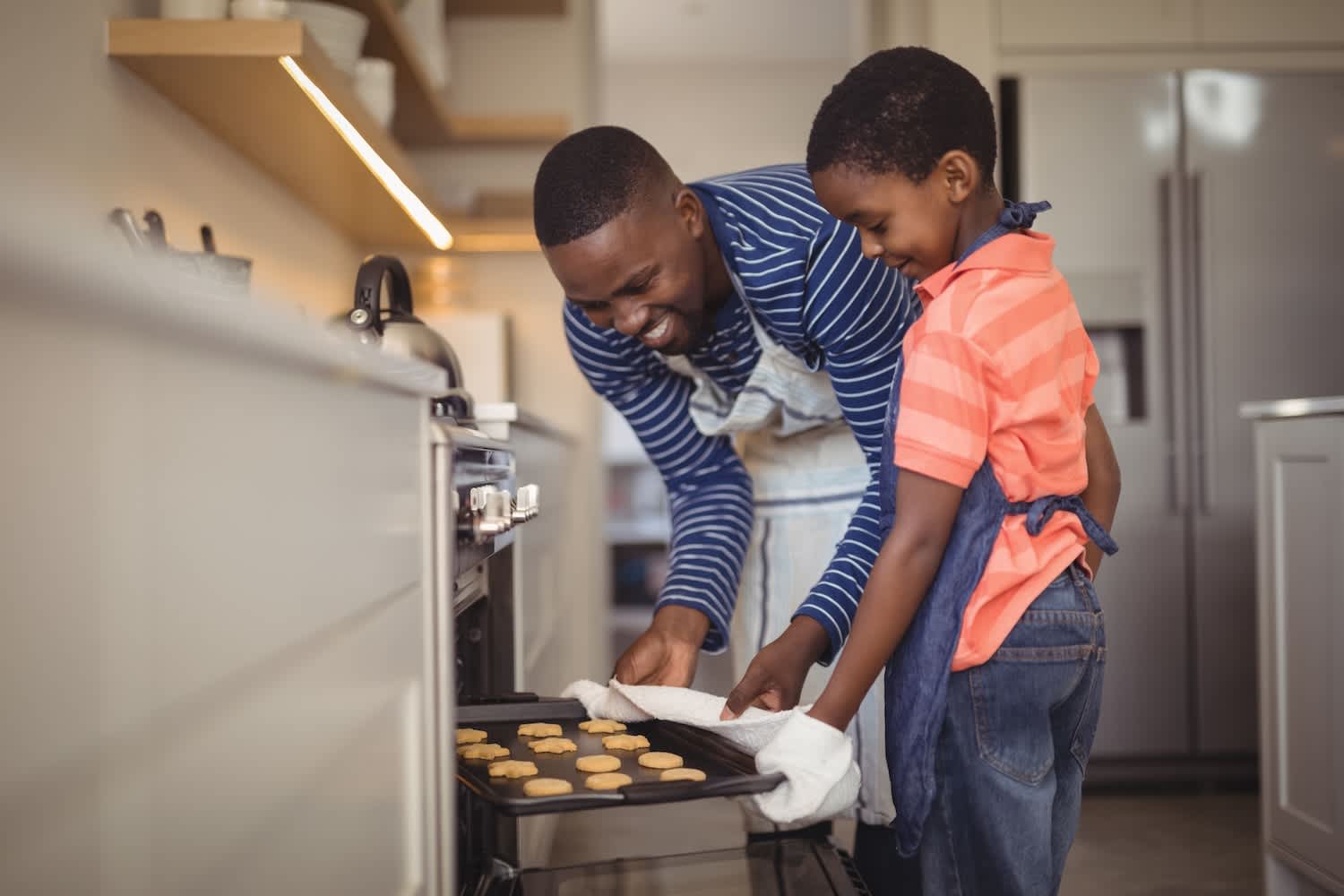 father and son baking cookies