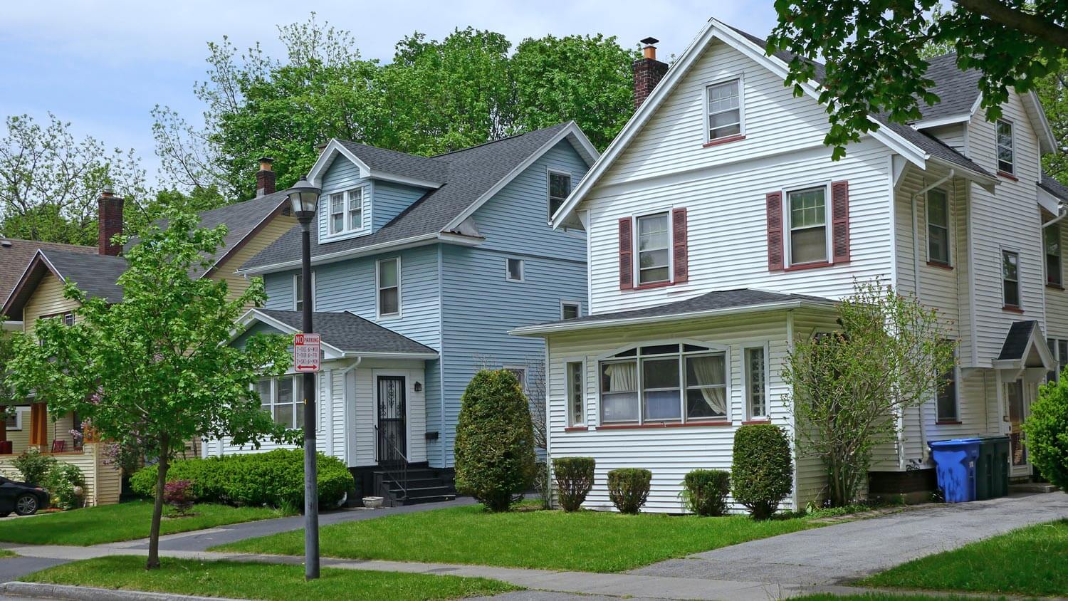 Suburban houses with gables and aluminum siding