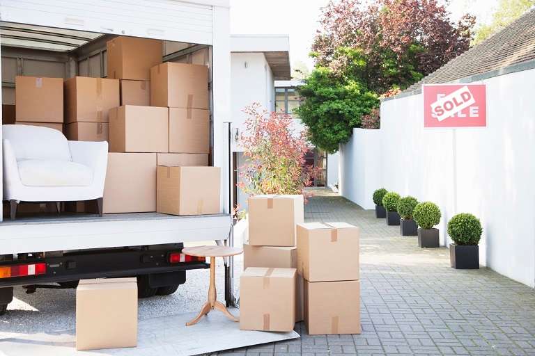 Boxes on ground near truck