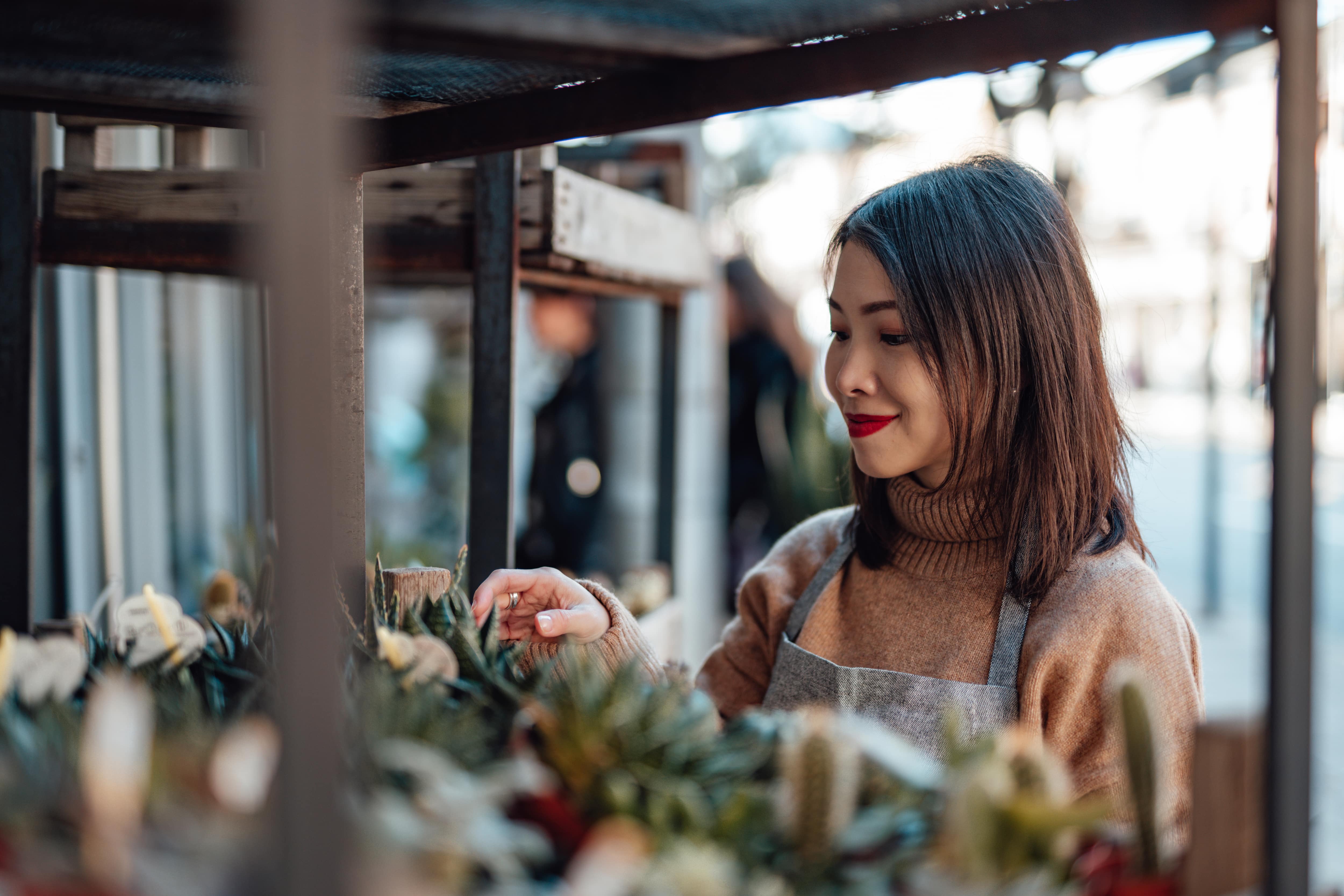 Woman buying succulents at a plant shop