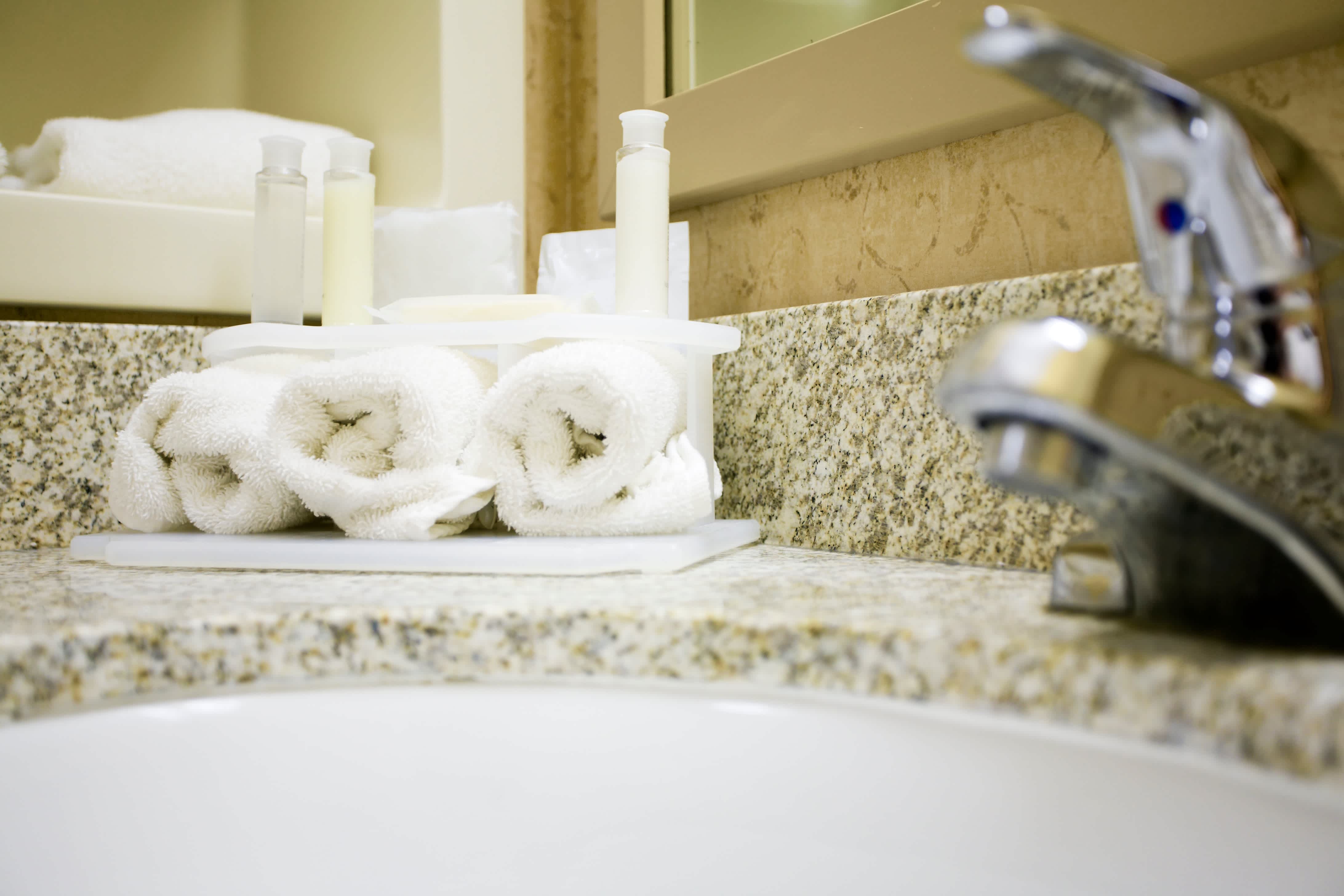 Close-up of granite countertops in a modern powder room