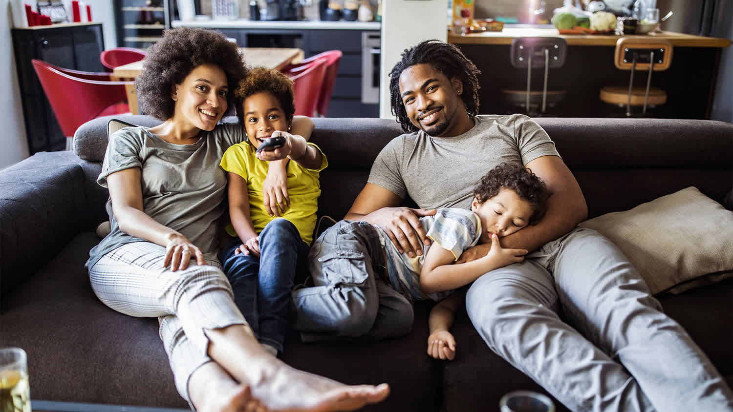 family Relaxing together as they watch tv