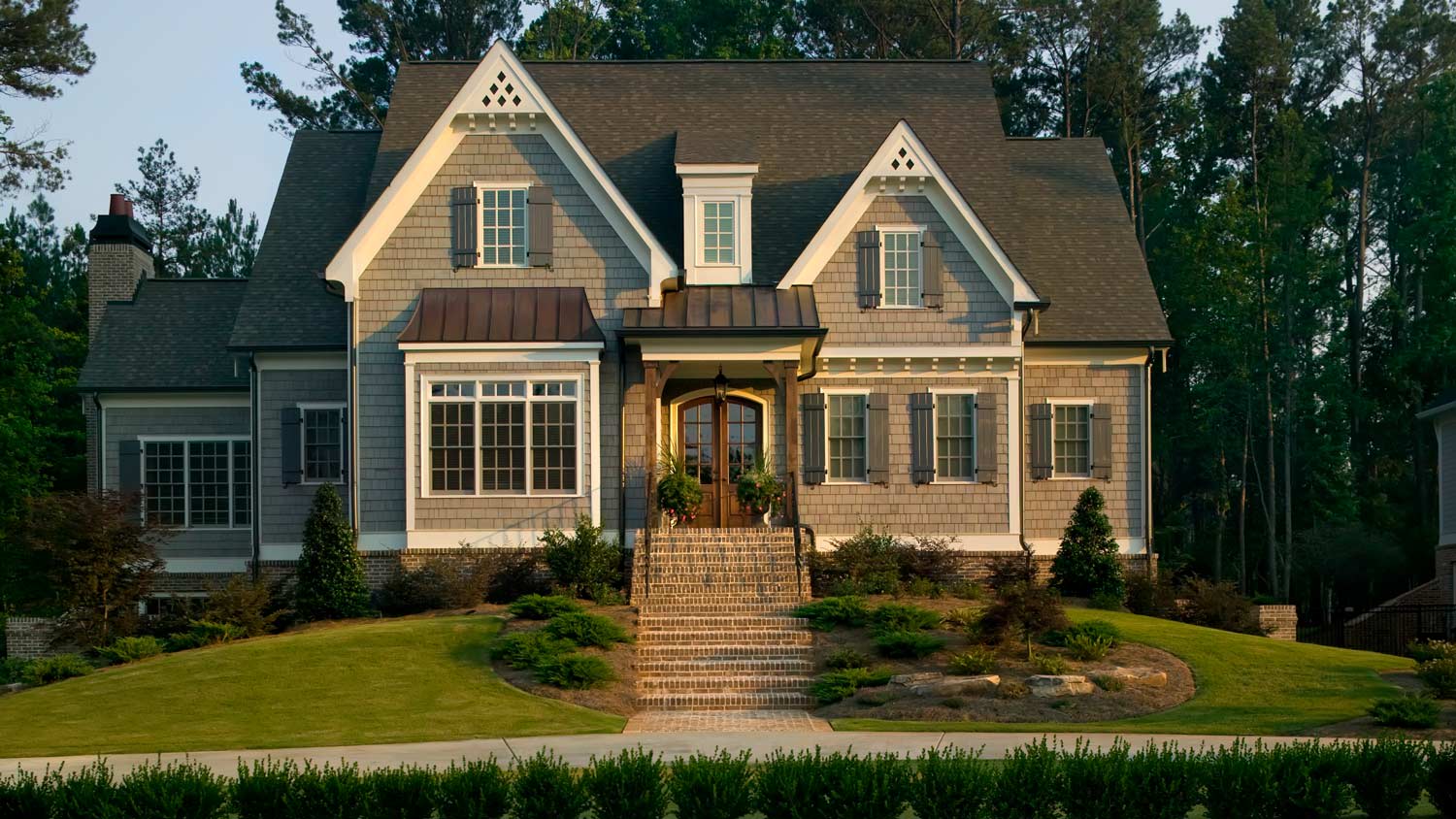 A suburban house with landscaped lawn