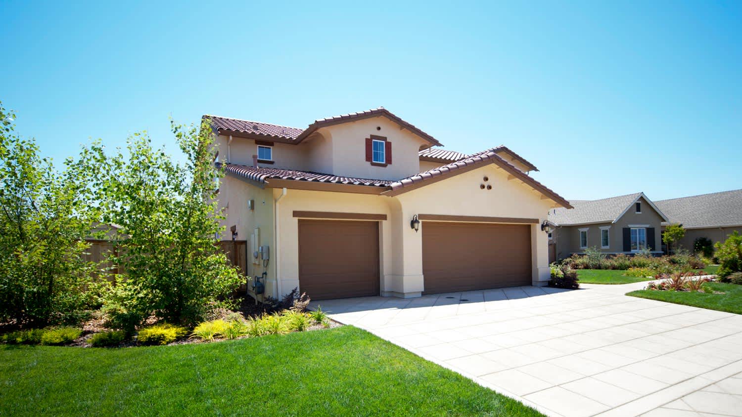 A suburban house with stucco siding