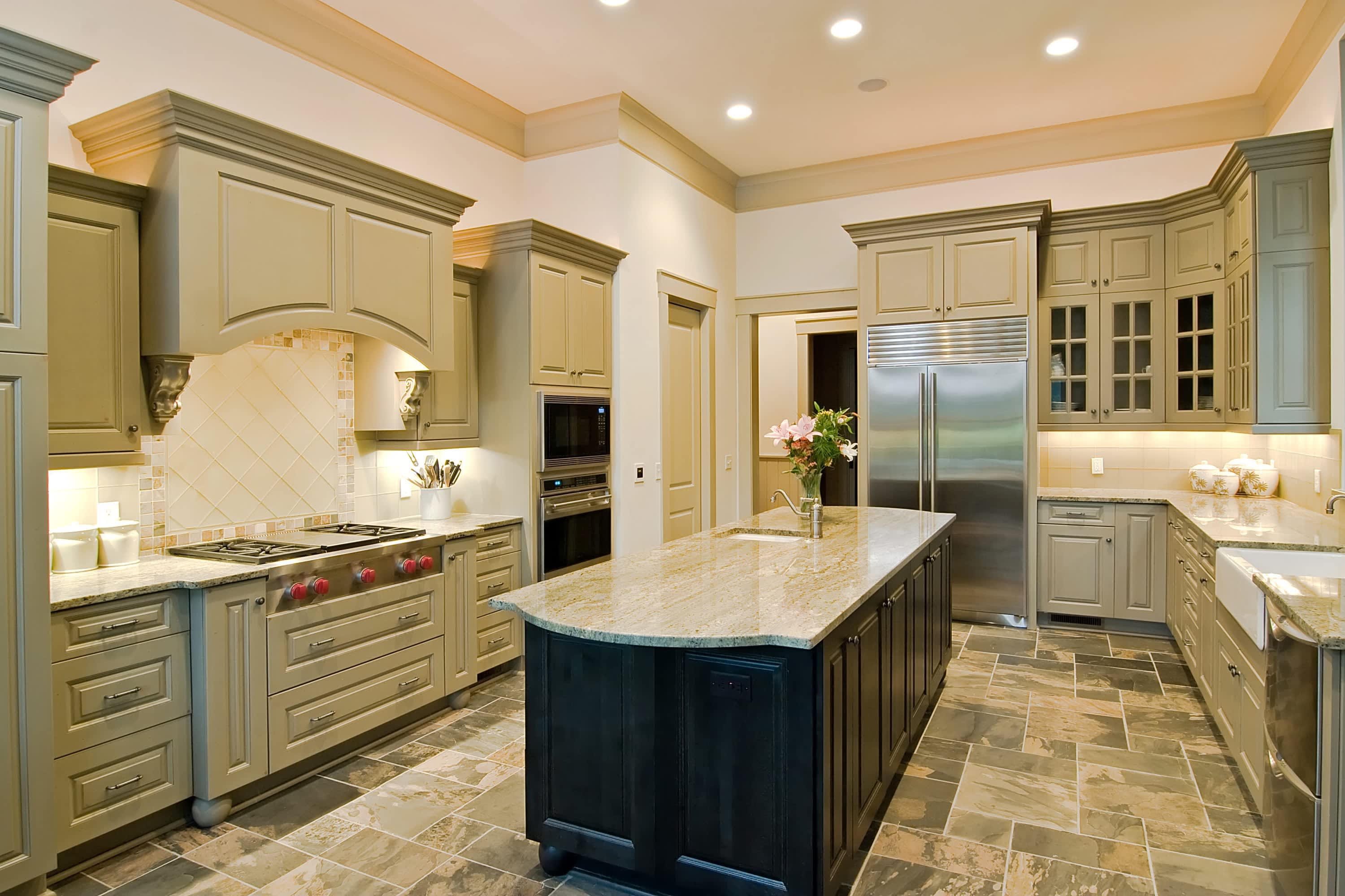 Large kitchen with two-toned wooden cabinets