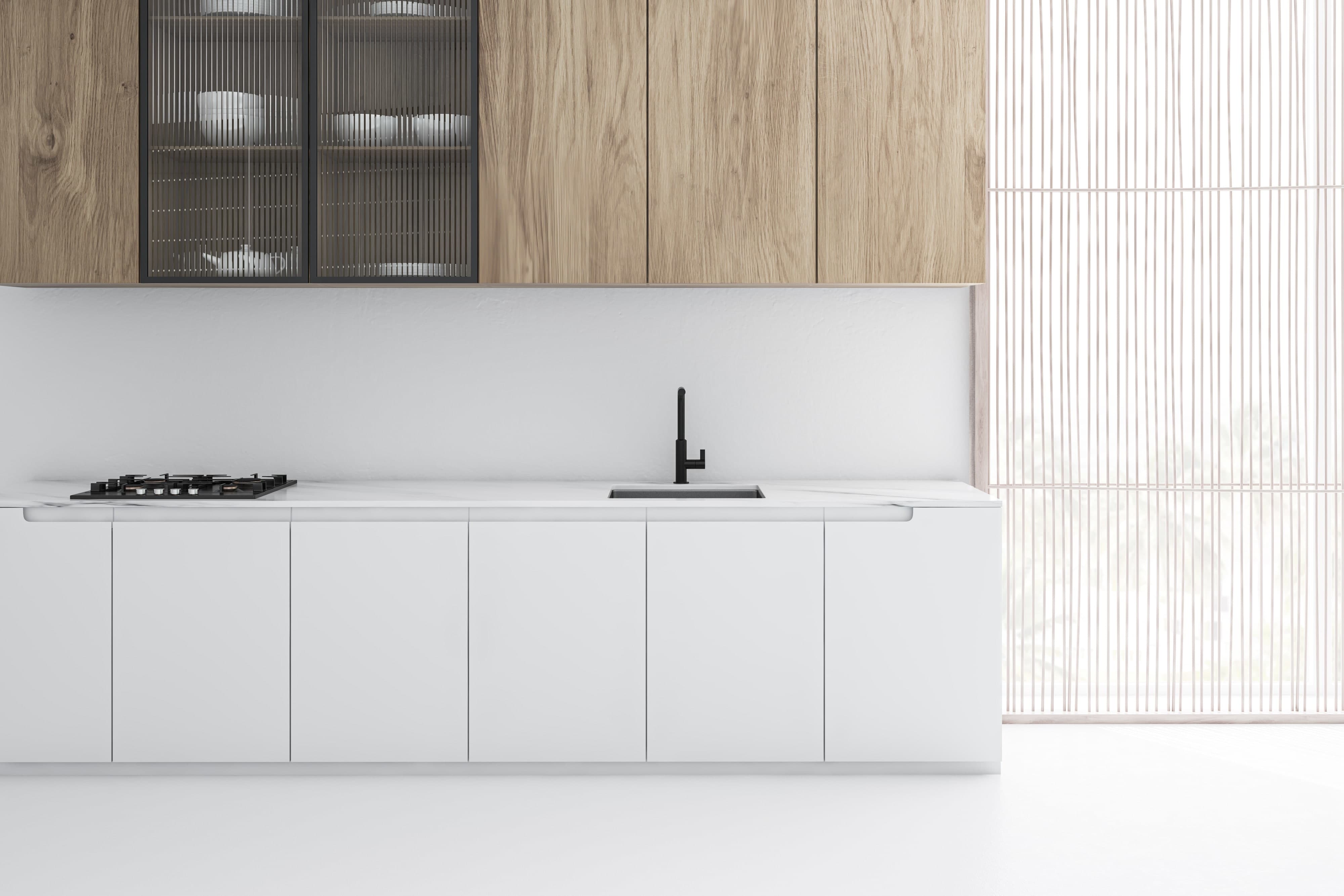White and light wood two-toned cabinets in kitchen