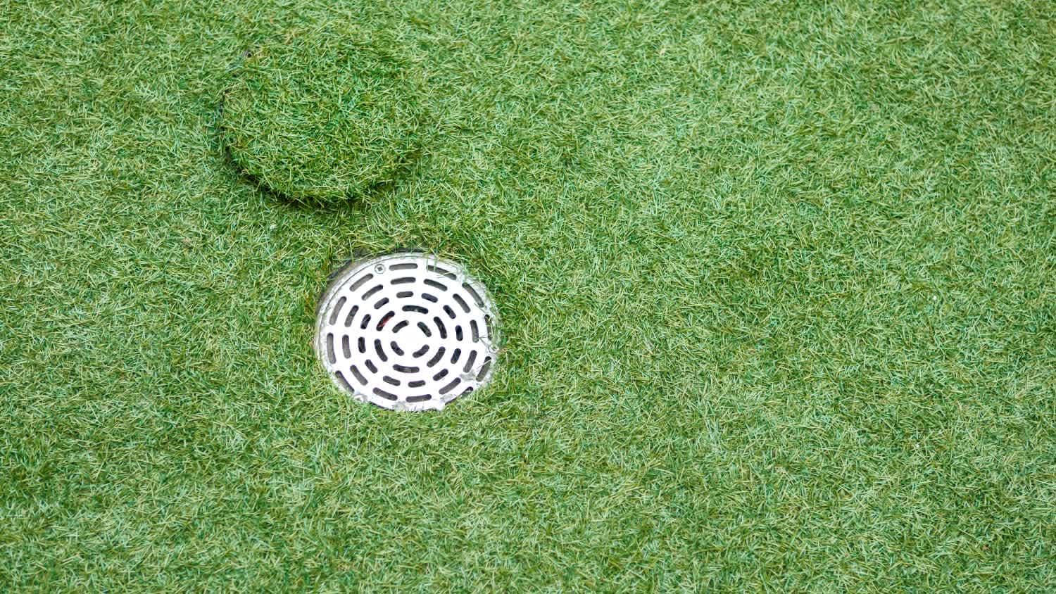 Artificial grass with drain water