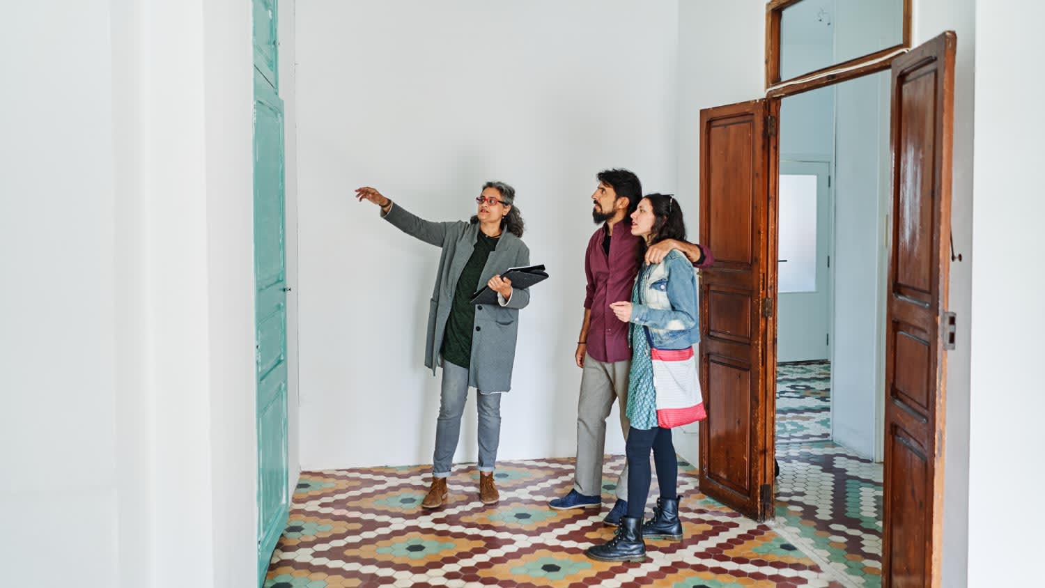 A diverse couple and real estate agent