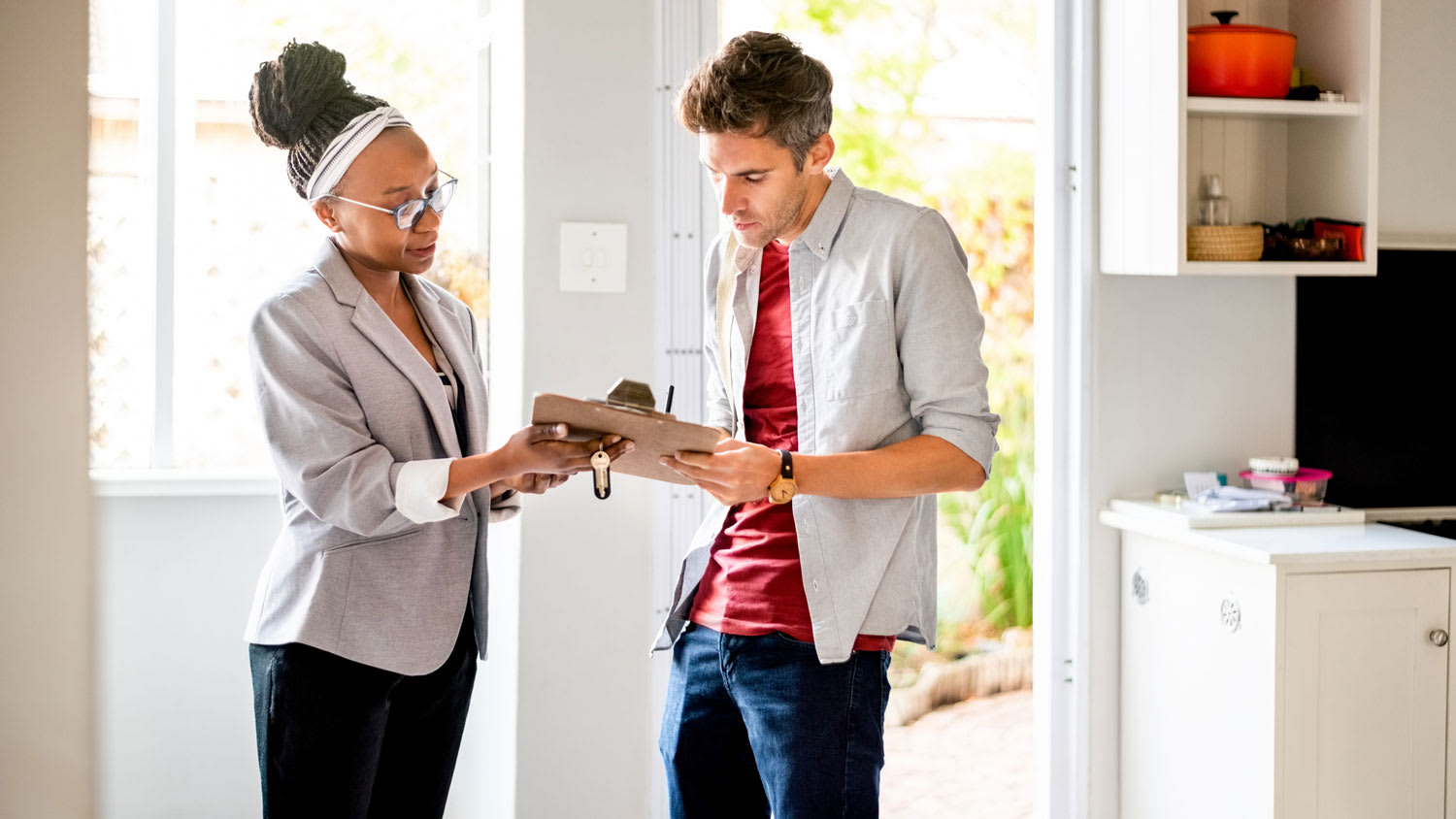 A man signing an apartment lease