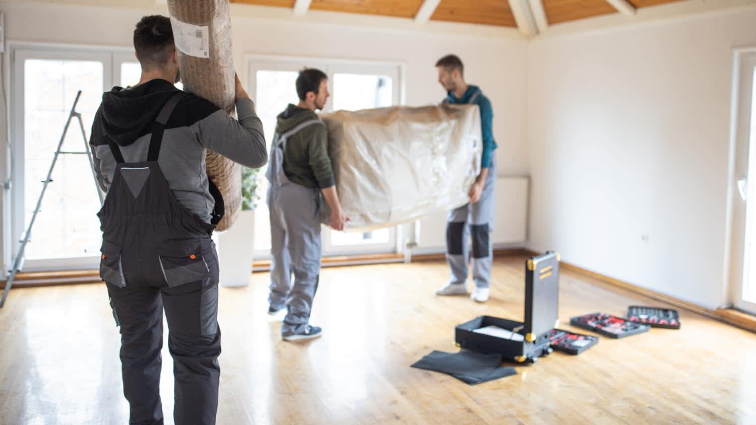Professional movers bringing in new furniture in house