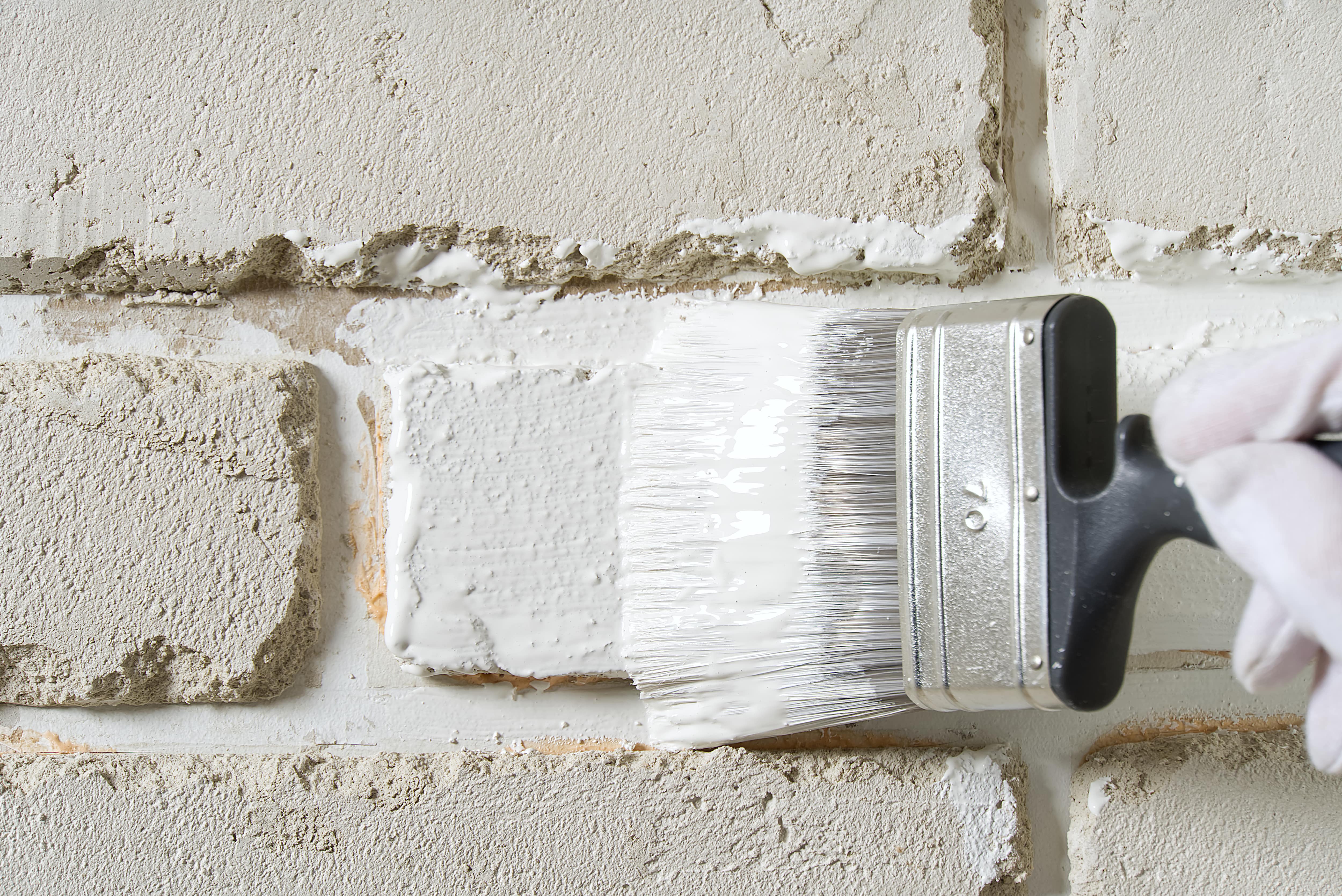 Painting brick white with paintbrush