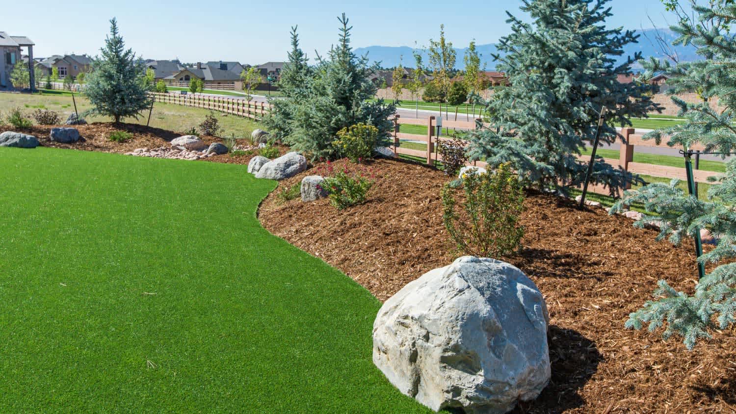 A backyard with artificial turf