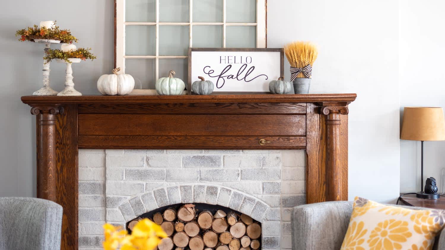 A fireplace with fall decoration