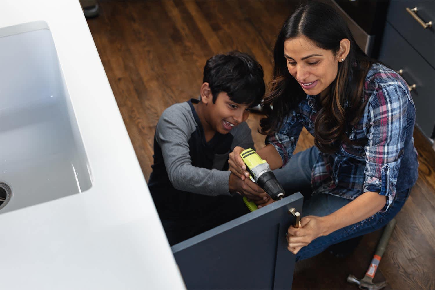 mother and son diy kitchen repair cabinets