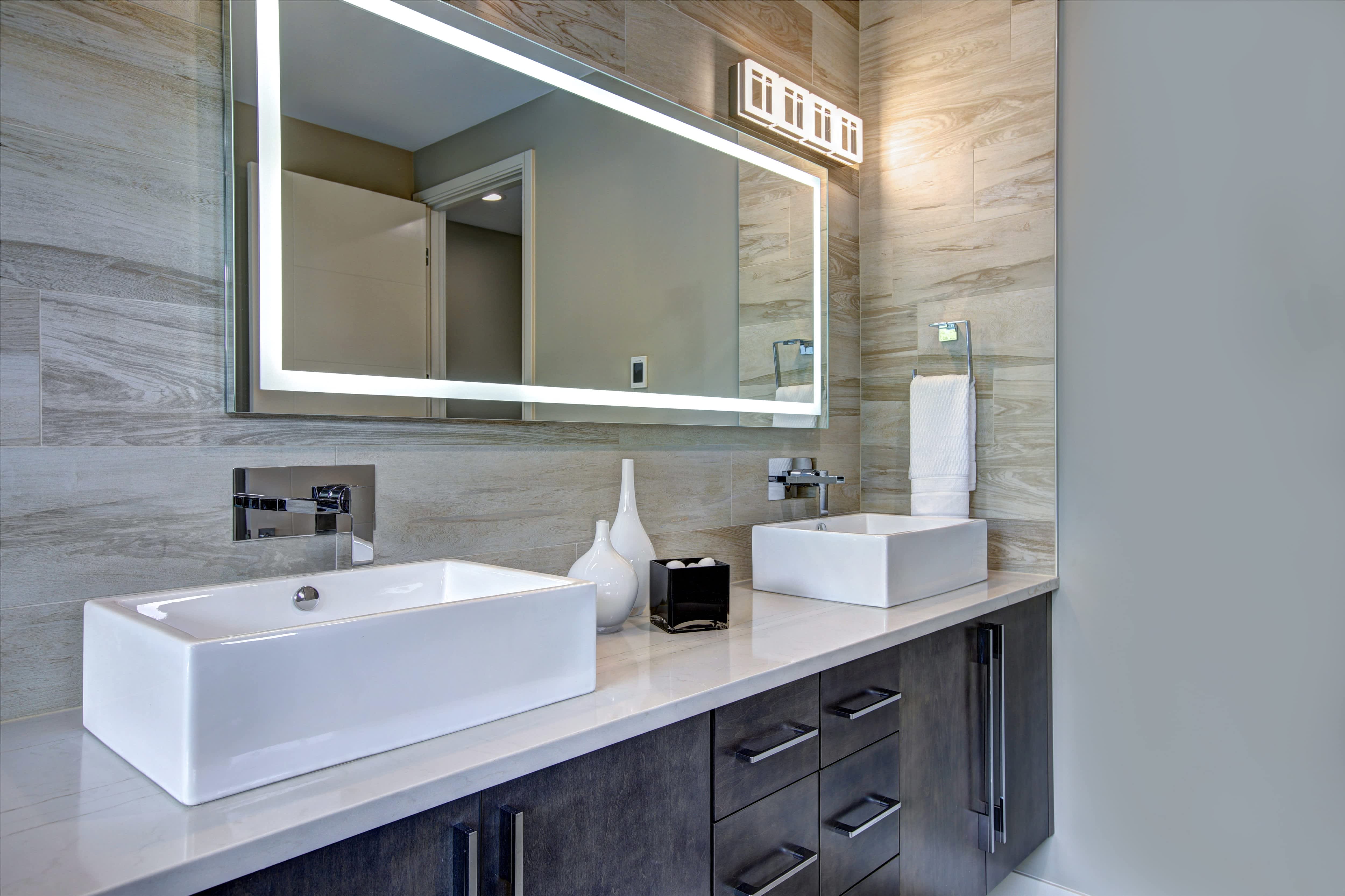 Contemporary bathroom mirror with illuminated border