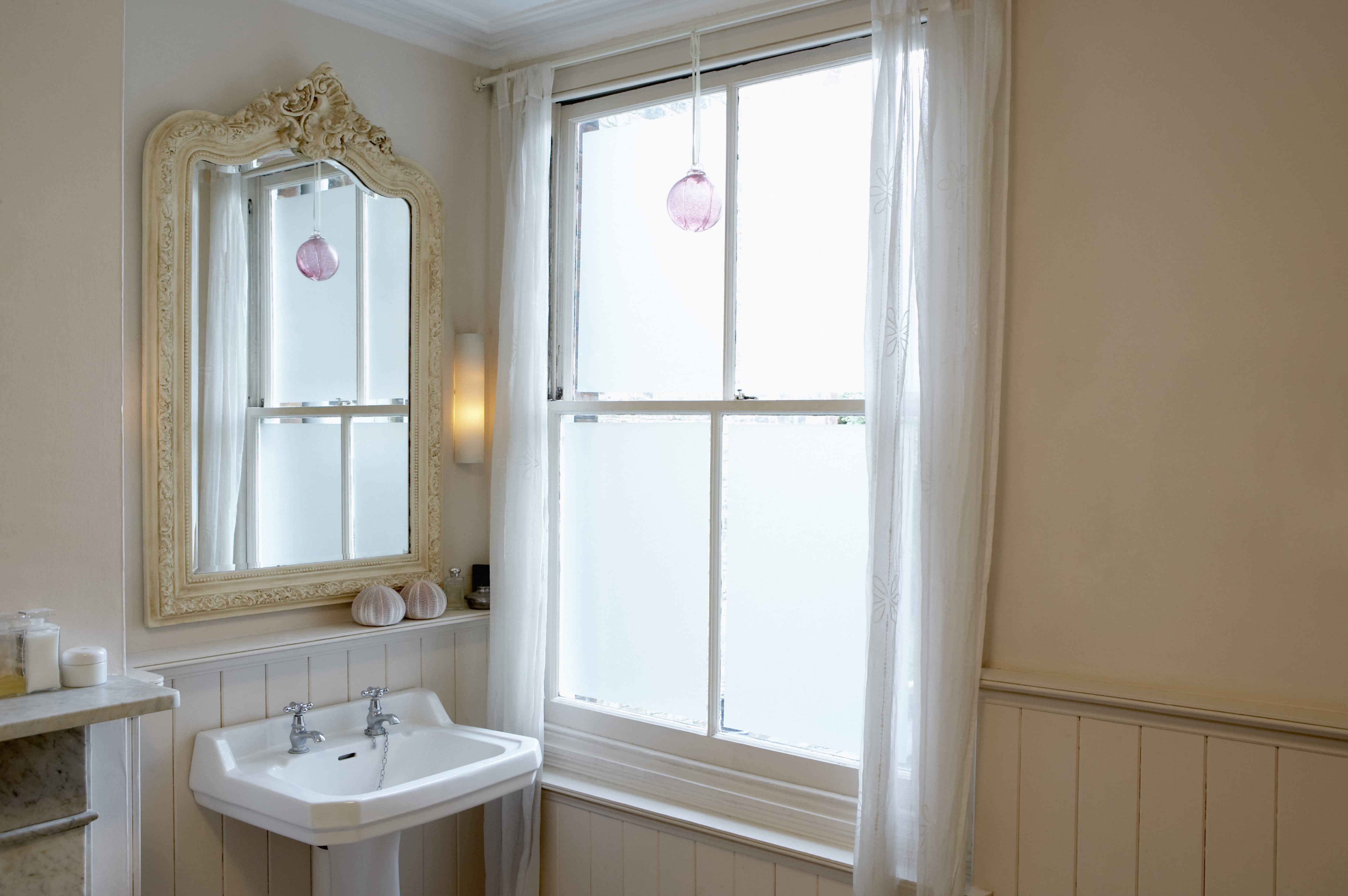 Shabby chic bathroom with antique upcycled mirror