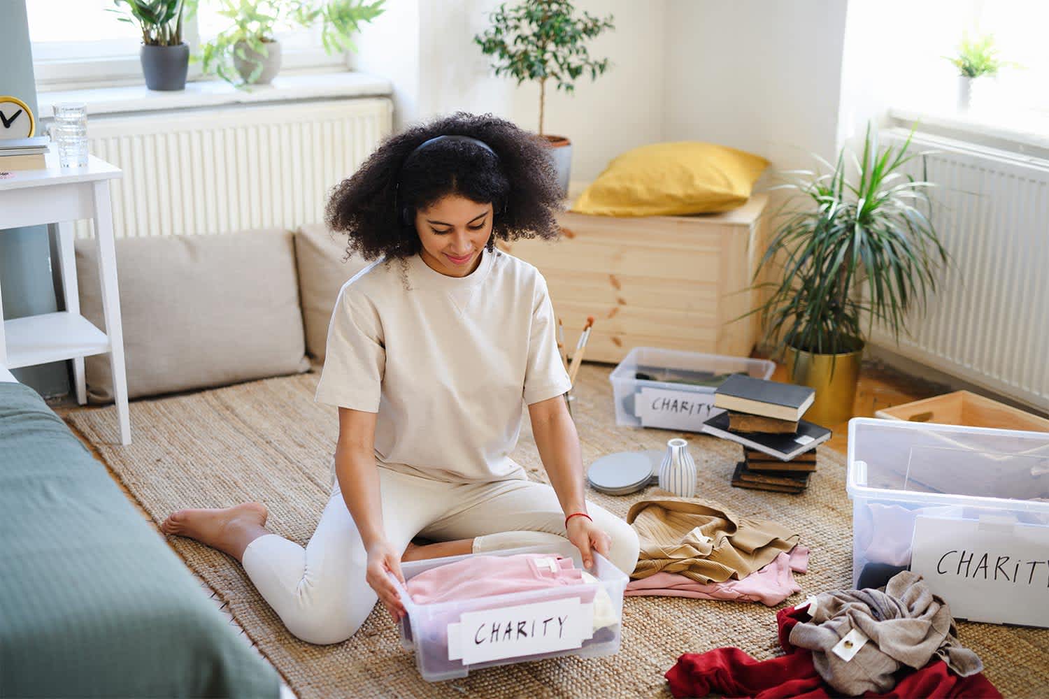Woman Sorting Clothes to Donate