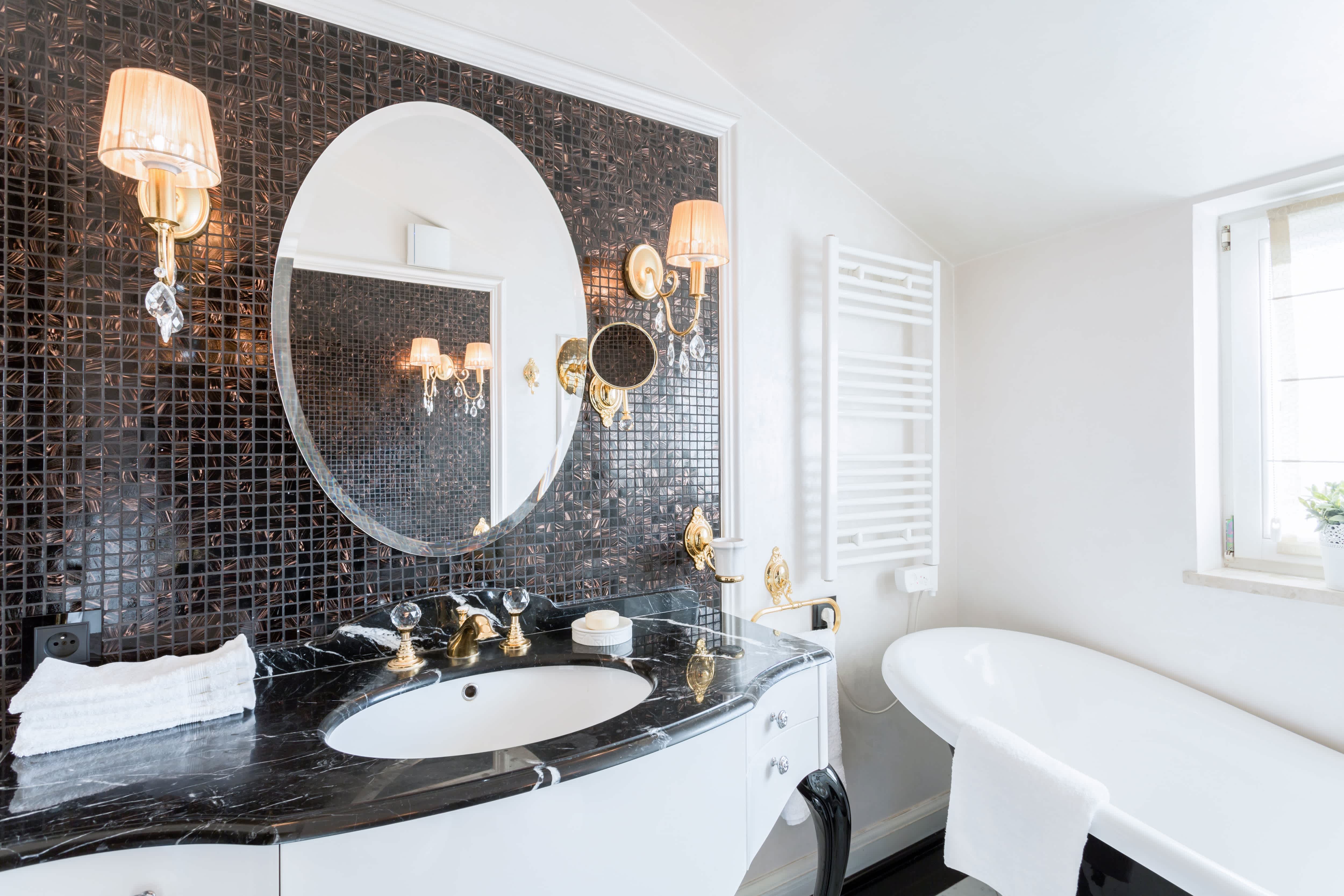 Beveled glass circular mirror in bathroom