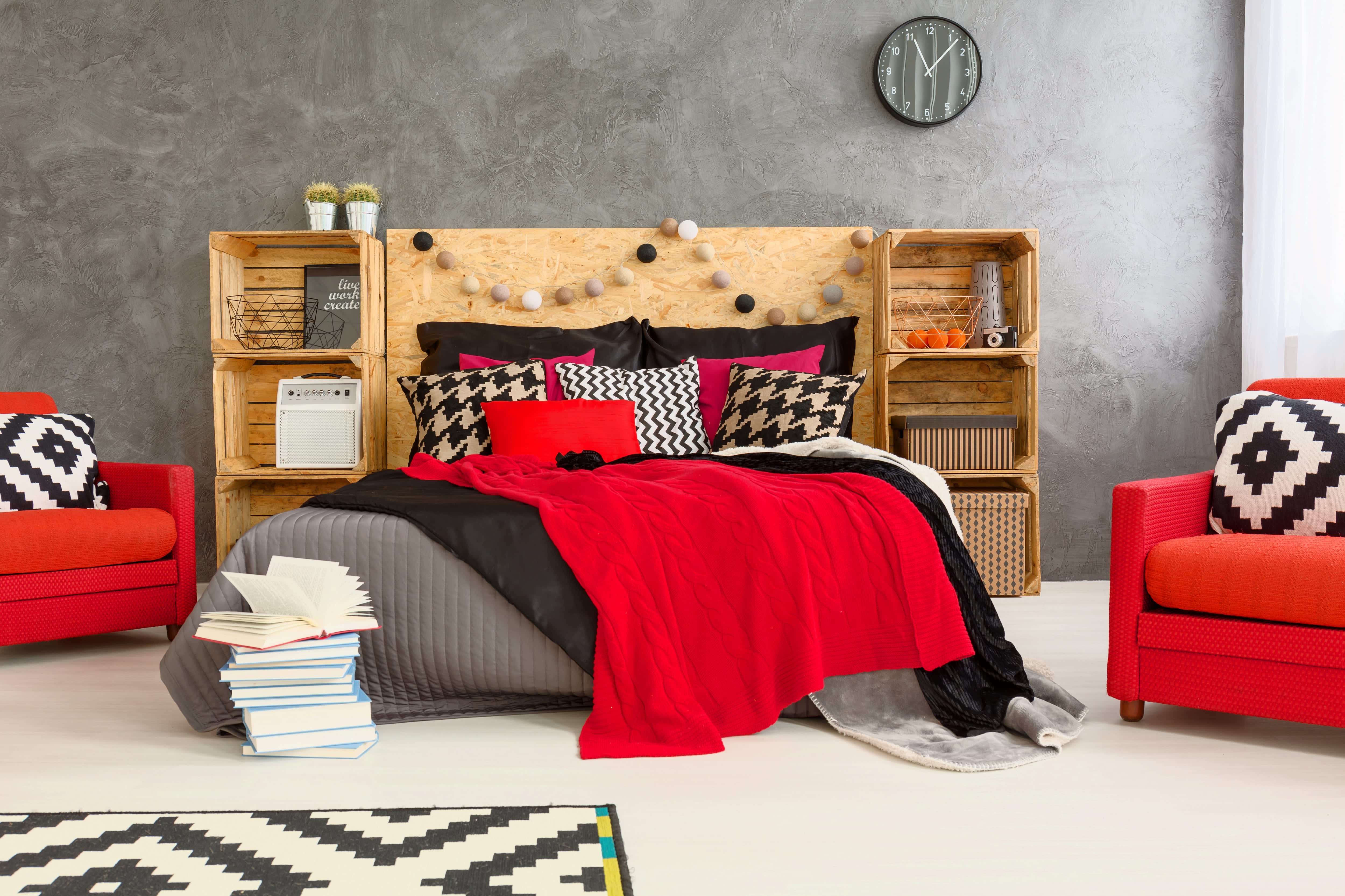 A bold bedroom with a headboard made from wood crates