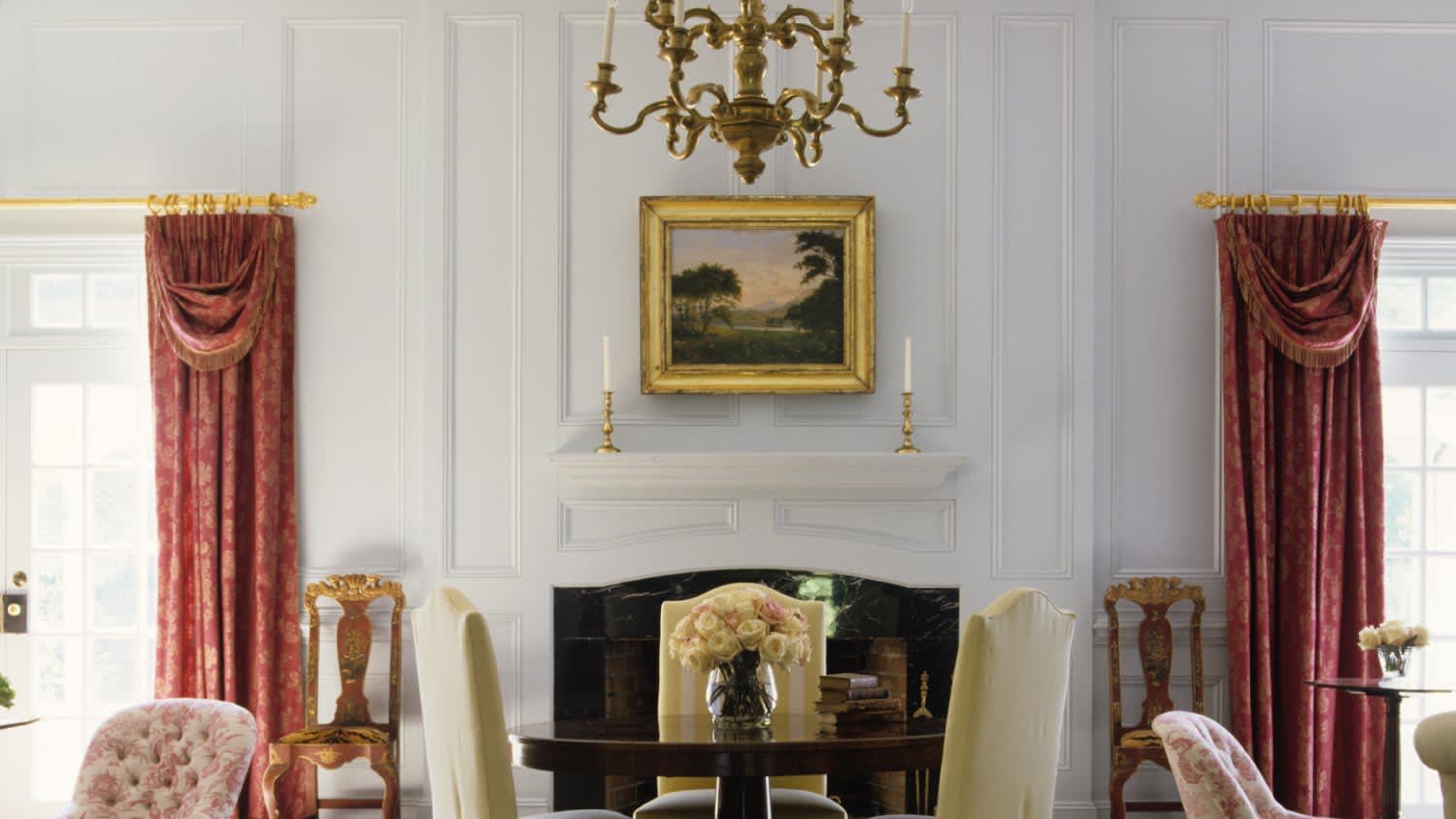 A chandelier over table in traditional living room