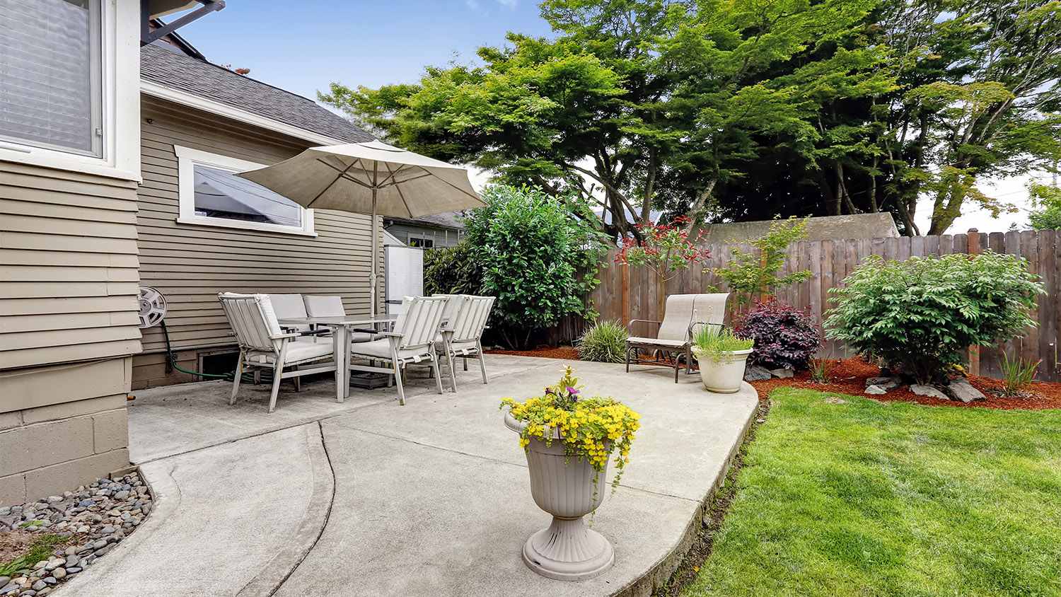concrete paver patio with landscaping