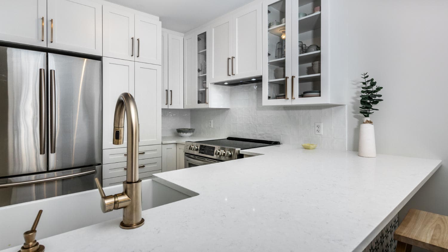 A modern kitchen with white countertops